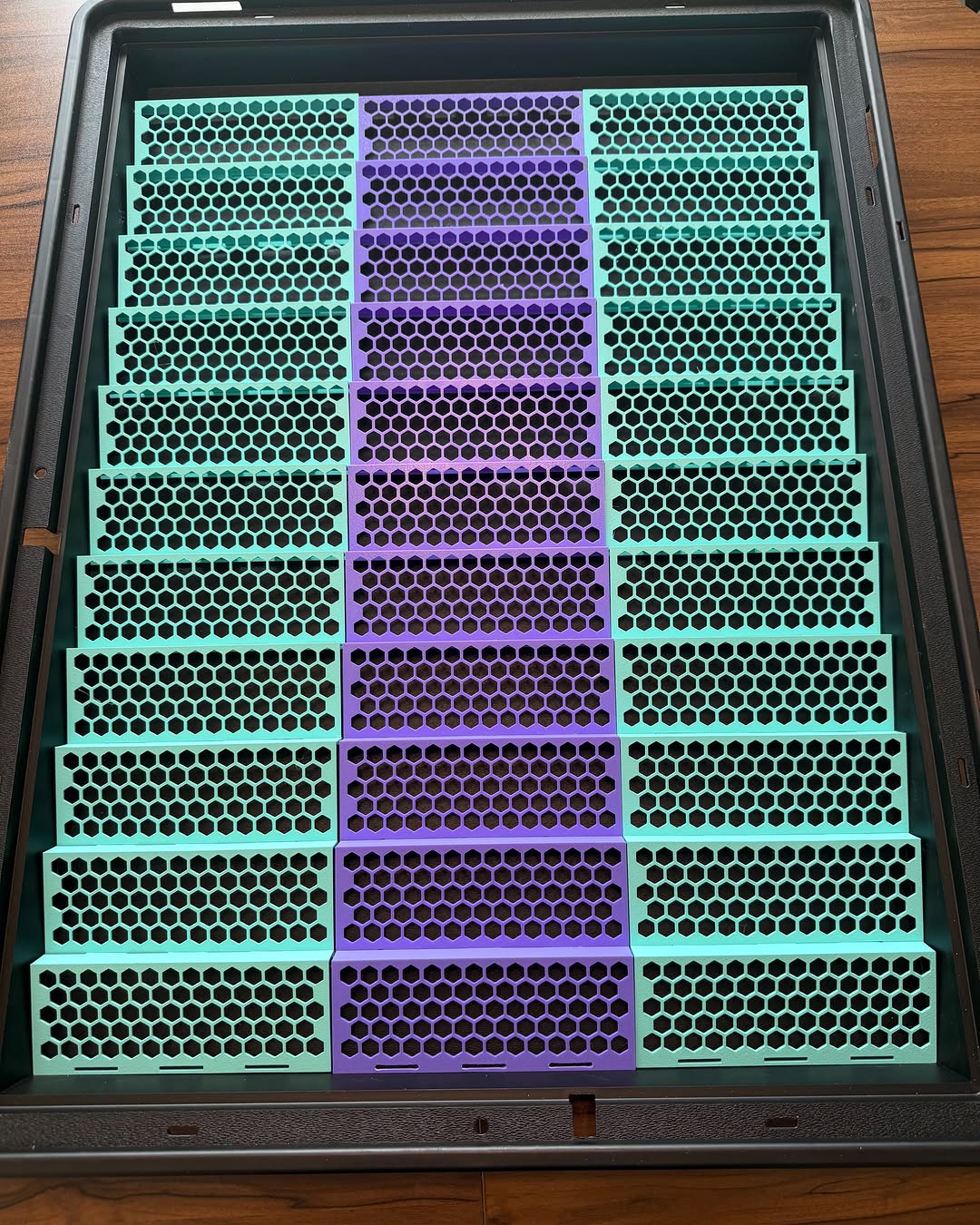 Turquoise and purple interlocking risers filling a vertical display case